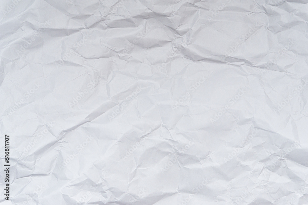 A mess of crumpled paper trash on a black background A mess of crumpled paper trash on a black background