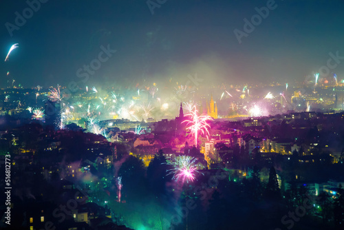 Colorful fireworks over the city at night