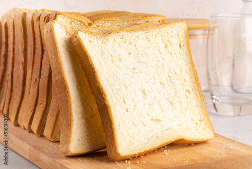 Stack of slice bread isolated on bright background. Close up.