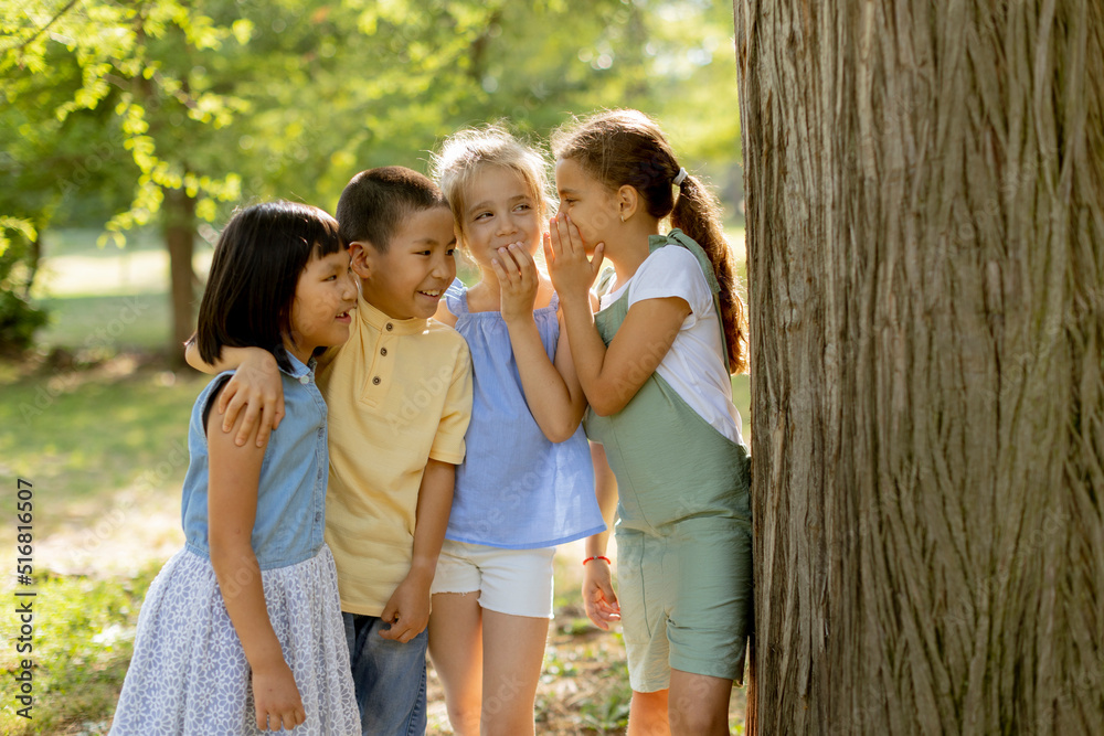 Group of asian and caucasian kids having fun in the park Group of asian and caucasian kids having fun in the park