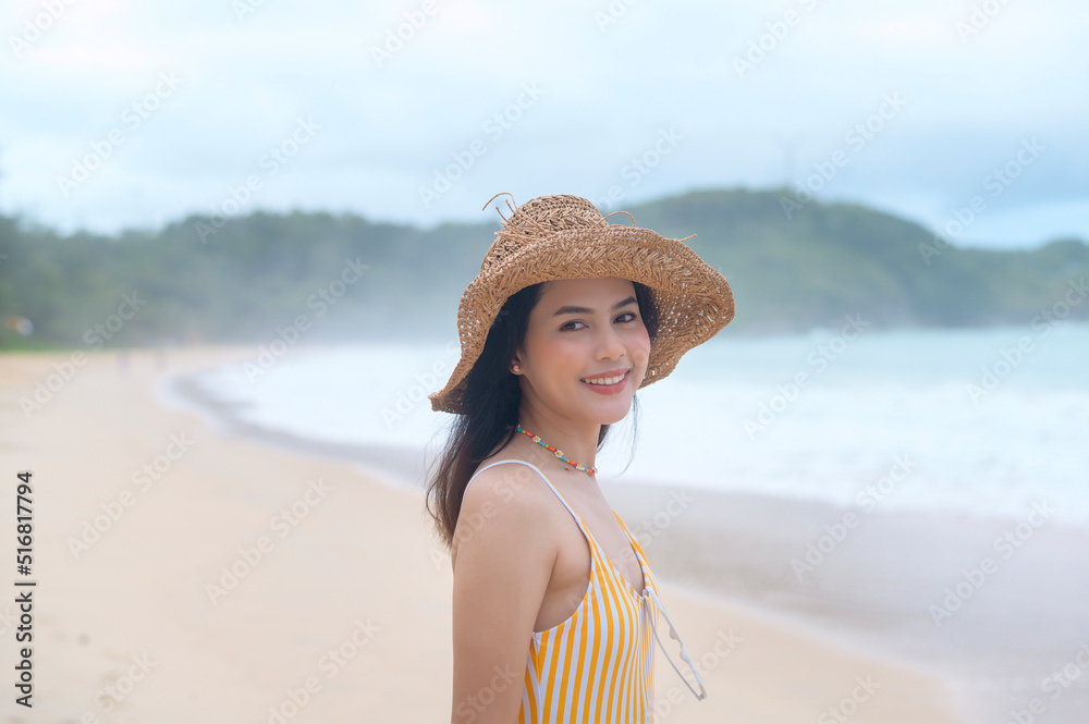 Young Beautiful woman in Bikini enjoying and relaxing on the beach,  Summer, vacation, holidays, Lifestyles concept.