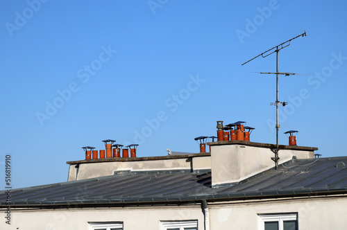 Close-up of chimneys on the rooftops of Paris