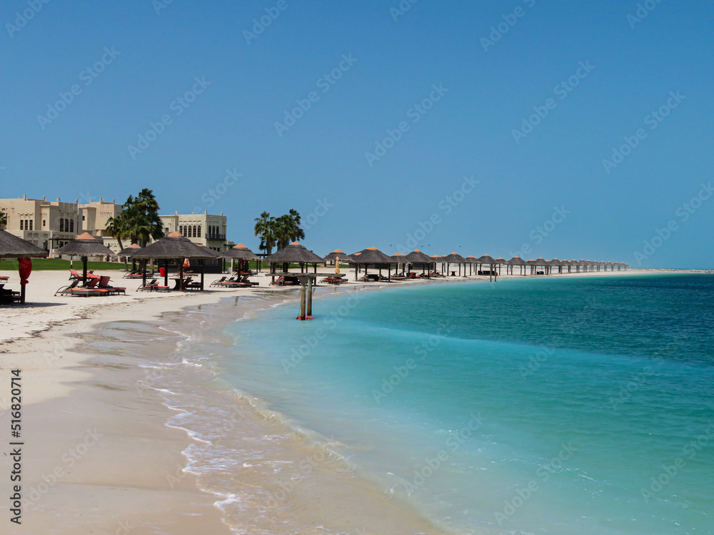 Obraz premium beach with umbrellas and chairs