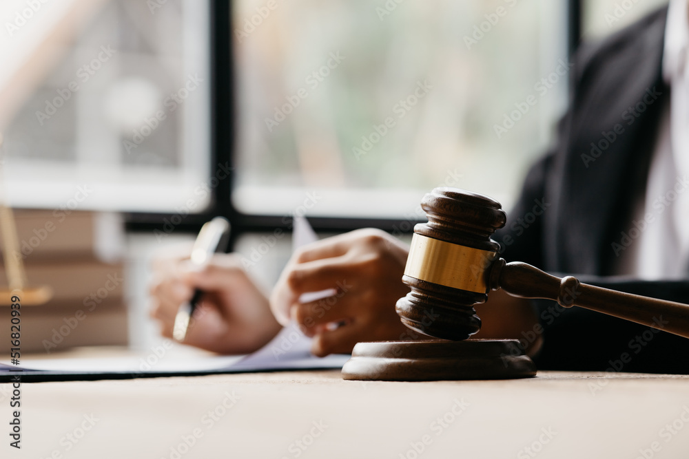 The judge's hammer is placed on the table, the lawyer concept assumes that the defendant defends the client in order to win the case or gain the greatest benefit in accordance with the law. The judge's hammer is placed on the table, the lawyer concept assumes that the defendant defends the client in order to win the case or gain the greatest benefit in accordance with the law.