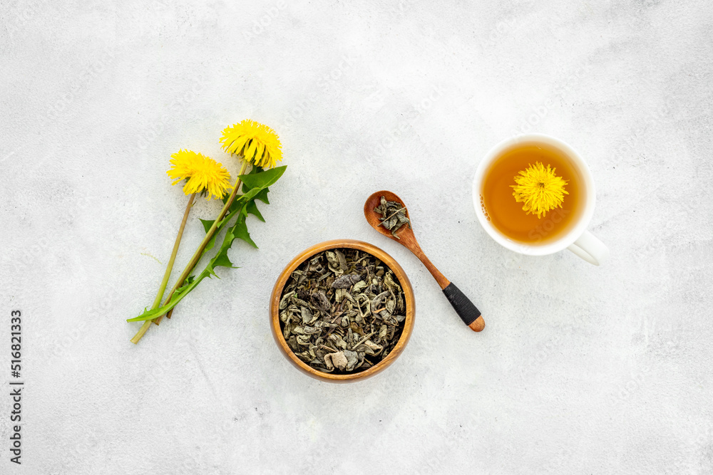 Healing herbs with tea. Yellow meadow dandelions and dry leaves Healing herbs with tea. Yellow meadow dandelions and dry leaves