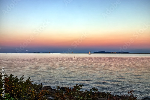 Even the shore gets lit up in red at dusk - Thunder Bay Marina  Ontario  Canada