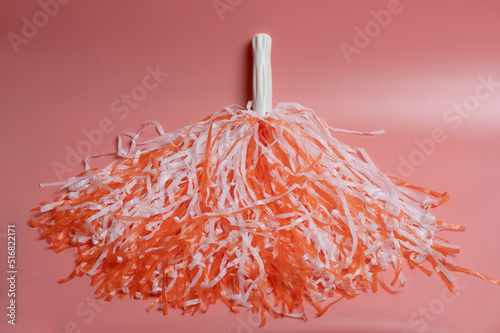 Orange and white color pom pom