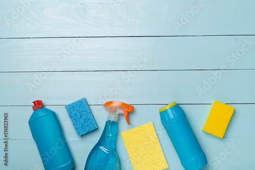 Many different house cleaning products on wooden background, top view