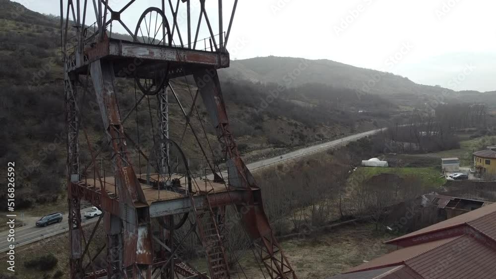 drone ascent to mining tower with mountain landscape in the background drone ascent to mining tower with mountain landscape in the background