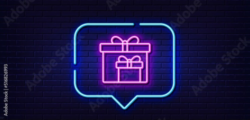 Neon light speech bubble. Gift boxes line icon. Present or Sale sign. Birthday Shopping symbol. Package in Gift Wrap. Neon light background. Delivery boxes glow line. Brick wall banner. Vector
