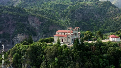 Wallpaper Mural Aerial drone shot of Greek orthodox church in the mountains in Central Greece. Torontodigital.ca