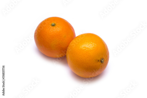 two tangerines lie on a white background photo