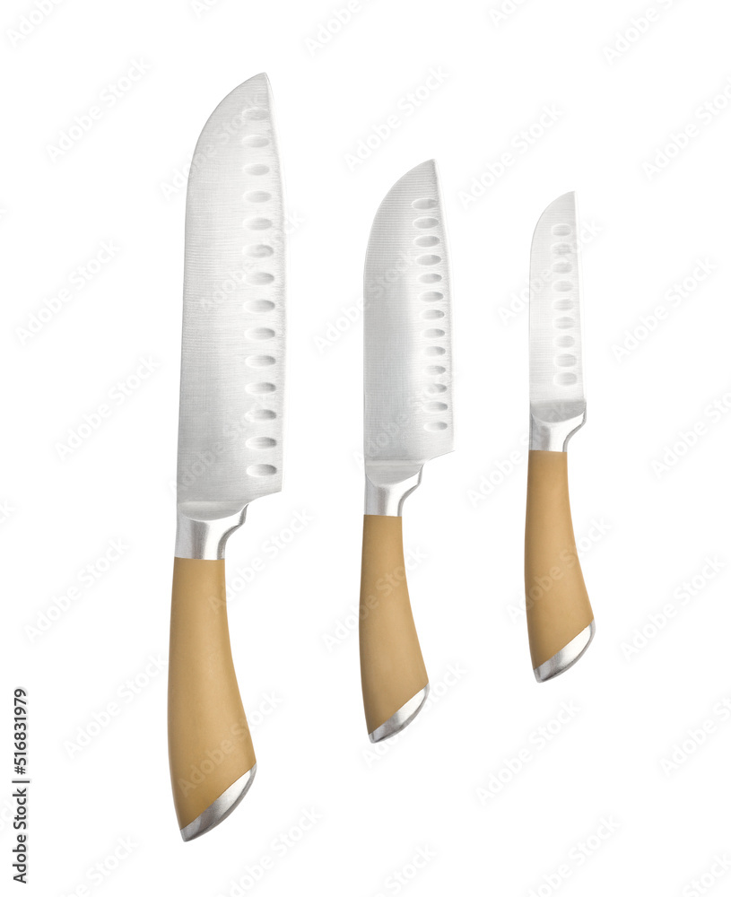 Set of three professional kitchen knives close-up isolated on white background Set of three professional kitchen knives close-up isolated on white background