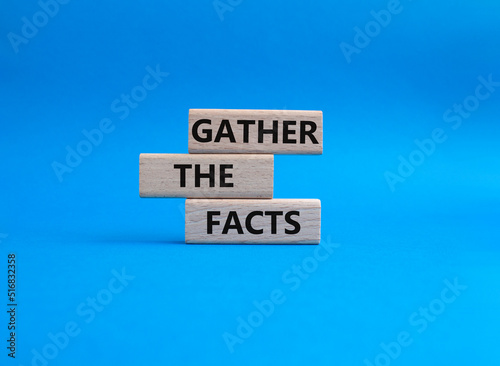 Gather the facts symbol. Wooden blocks with words Gather the facts. Beautiful blue background. Business and Gather the facts concept. Copy space.