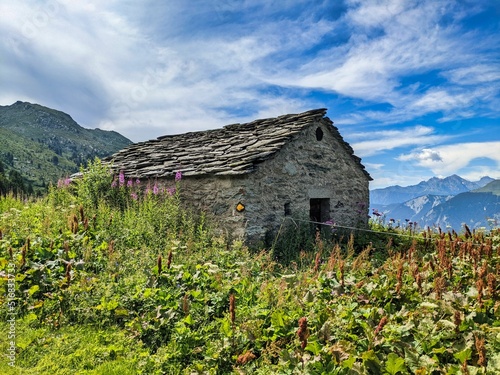 old alpine hut in the valais mountains. Hut in the swiss alps with a beautiful view of the mountains. High quality photo