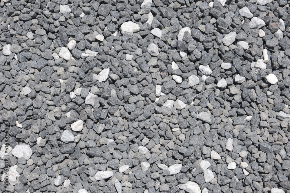 A decorative floor texture made of fragmented small natural stones A decorative floor texture made of fragmented small natural stones