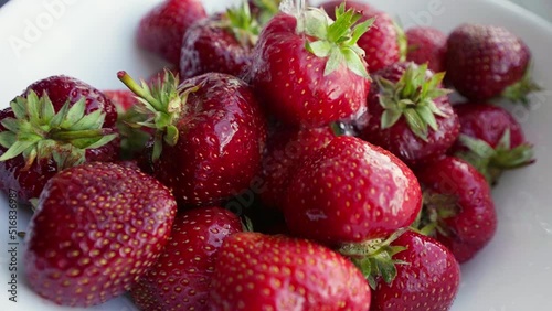 Fresh strawberries washed under running water