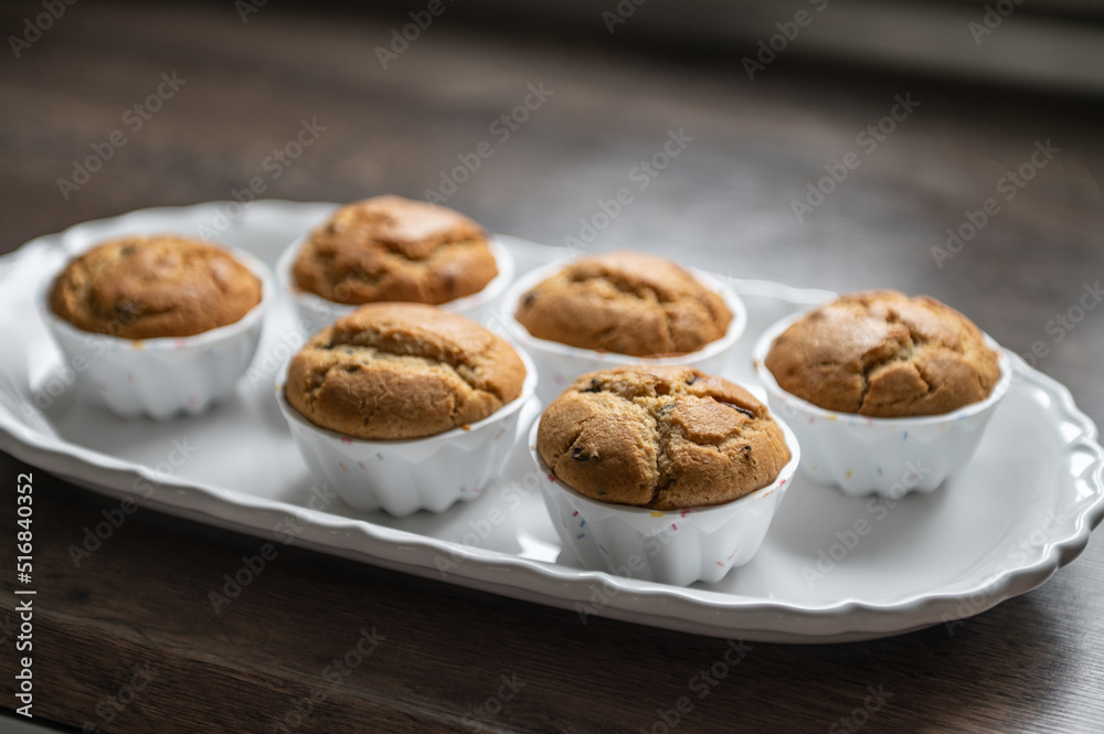 Sweet muffins freshly baked on modern white plate Sweet muffins freshly baked on modern white plate