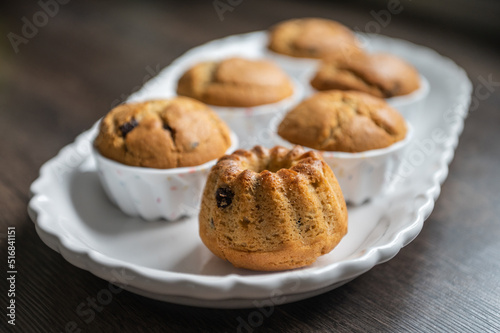 Appetizing muffins on beautiful plate