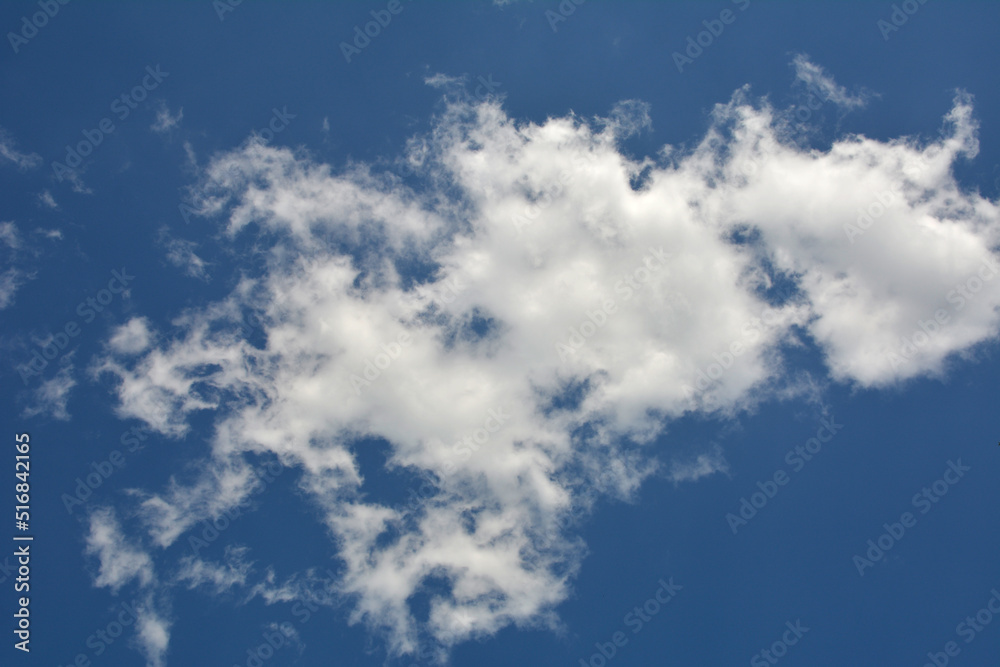 Clouds in the blue sky . Clouds in the blue sky .