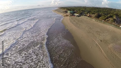 Aerial view on the beach, bathhouse and sea