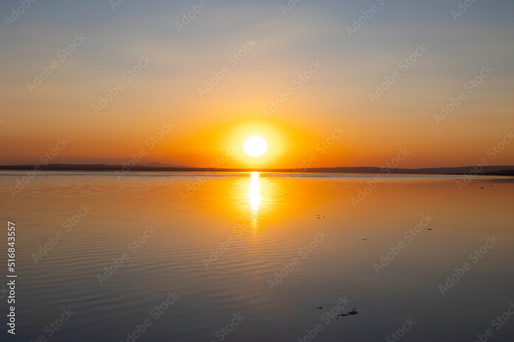 Sunset or sunrise over the lake. Natura background photo.