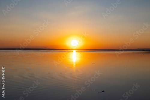 Sunset or sunrise over the lake. Natura background photo.