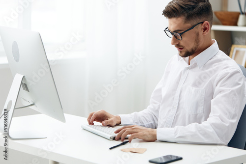 businessmen wearing glasses sits at a desk office worked executive