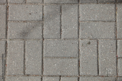 Paving of streets with gray paving slabs. Improvement of the city. Background texture.