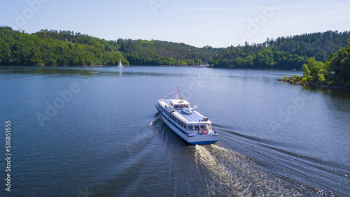 Aerial view of cruise ship on Orlik reservoir. Beautiful cruise on the lake. Orlik nad Vltavou, South Bohemia, Czech republic.