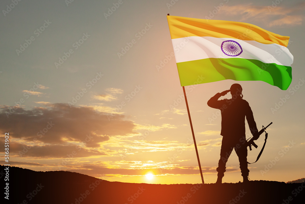 Fototapeta premium Silhouette of soldier with India flag on a background the sunset or the sunrise. Greeting card for Independence day, Republic Day. India celebration.