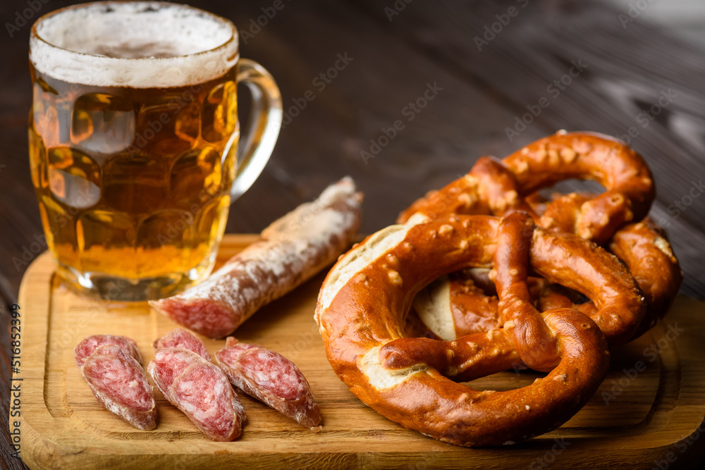 traditional mug of beer, pretzels and fuet sausage traditional mug of beer, pretzels and fuet sausage