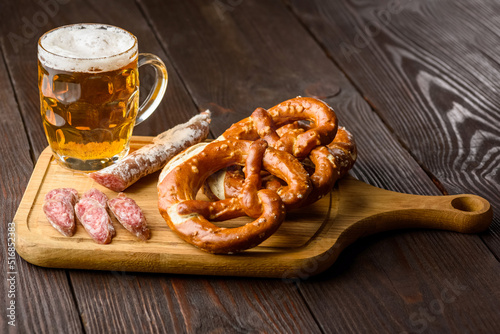 traditional mug of beer, pretzels and fuet sausage