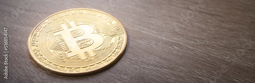 bitcoin coin on a wooden table