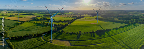 Panorama aerial view of countryside with windmills and agriculture fields. Landscape with corn, grain, maize fields and different variety of harvest, from the air perspective, Germany, Europe. 
 photo