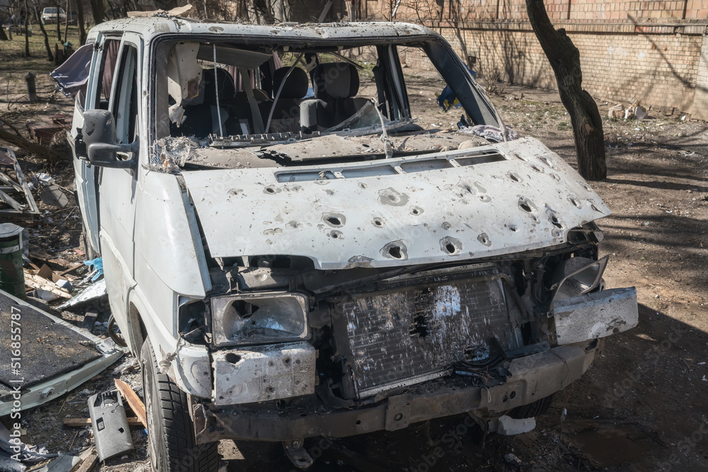 Minibus damaged by fragments of artillery shells (the concept of killing civilians)