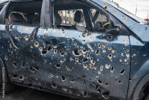 Car damaged by fragments of artillery shells (the concept of killing civilians)