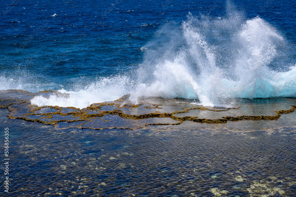 Fototapeta premium waves crashing on rocks and blow hole geyser