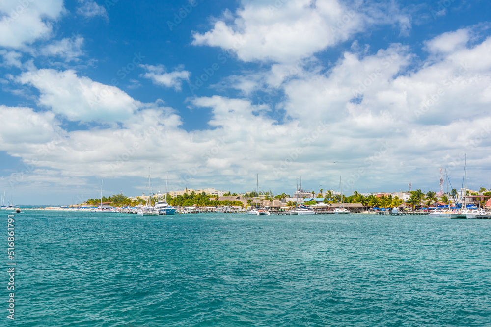 Port with sailboats and ships in Isla Mujeres island in Caribbean Sea, Cancun, Yucatan, Mexico