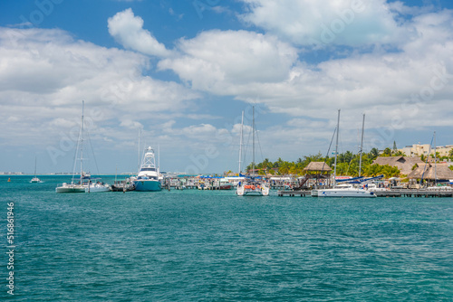 Port with sailboats and ships in Isla Mujeres island in Caribbean Sea, Cancun, Yucatan, Mexico