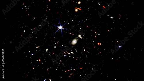 Wide field video of the deepest universe. Zooming into thousands of galaxies in a tiny sliver of the vast universe. Fly towards extremely distant galaxies revealing the view of the early universe. photo