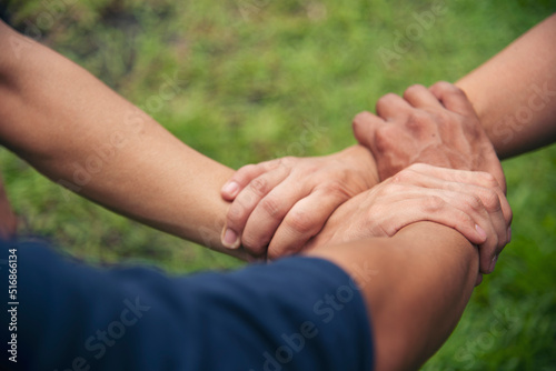 Close up three hands Diverse multiethnic Partner team together. Teamwork group of multiracial people meeting join hands together. Diversity people hand join empower partner team trust team solidarity