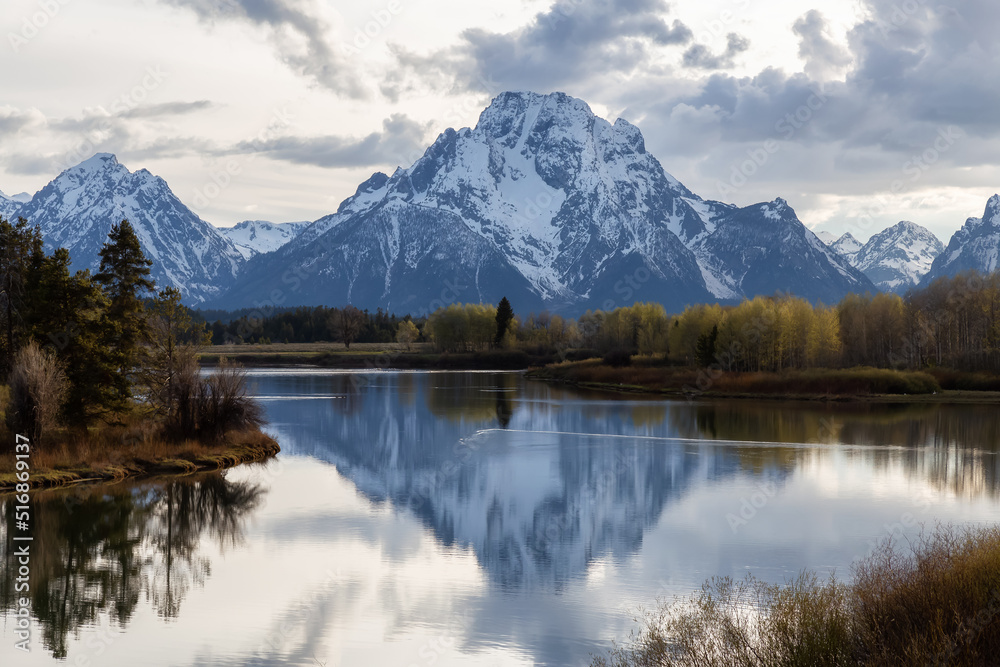 River surrounded by Trees and Mountains in American Landscape. Snake River, Oxbow Bend. Spring Season. Grand Teton National Park. Wyoming, United States. Nature Background.