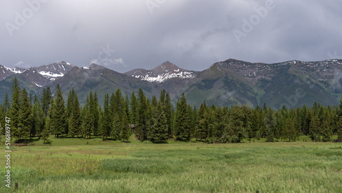 Dark, heavy clouds threaten a series of mountain peaks near Glacier National Park.