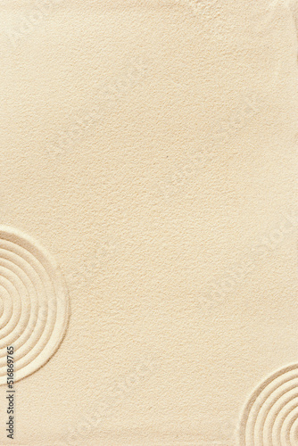 Aesthetic minimalist pattern in Japanese Zen Garden with concentric circles on sand, beautiful sandy texture, Spa background, concept for meditation and relaxation. Top view fine sand