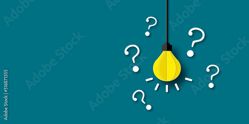 Yellow light bulb with white question mark on dark green background as metaphor for business idea problem. shadow overlay. copy space for text. illustration paper cut design style. photo