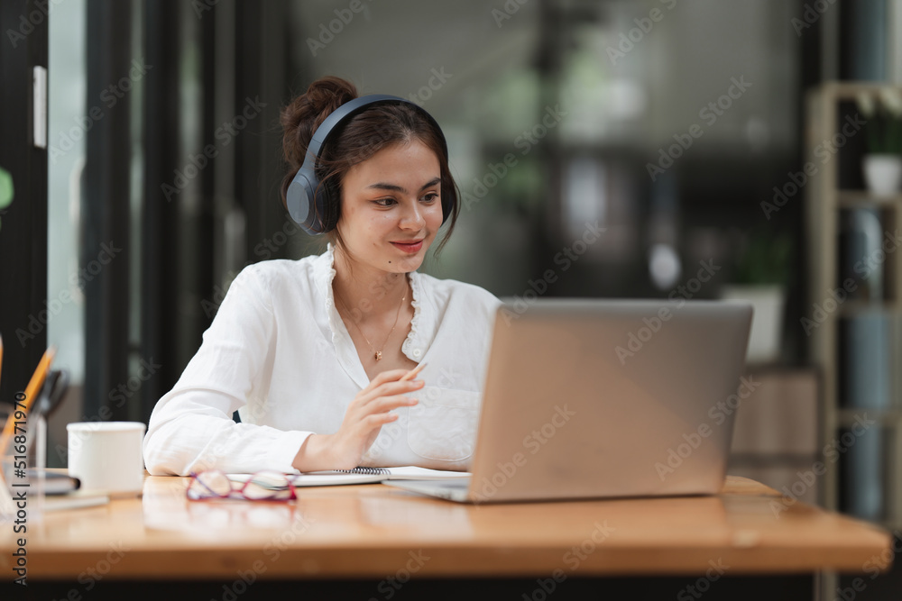 Image of Young woman working online on laptop computer. studying or working from home online concept. Image of Young woman working online on laptop computer. studying or working from home online concept.
