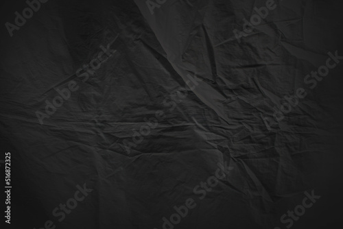 abstract wrinkled black surface sheet material background backdrop