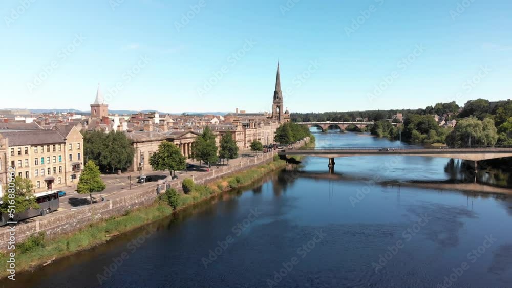 Drone view above River Tay and Perth on a sunny day with blue sky. Drone gaining altitude