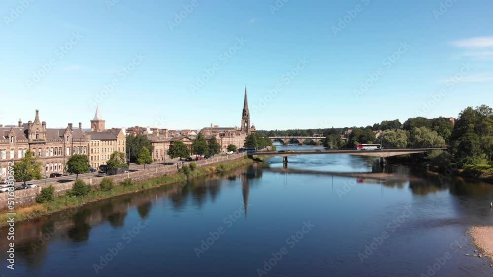 Drone descending above river Tay revealing beautiful reflection of St. Matthew's Church of Scotland. Perth, United Kingdom. Drone descending above river Tay revealing beautiful reflection of St. Matthew's Church of Scotland. Perth, United Kingdom.